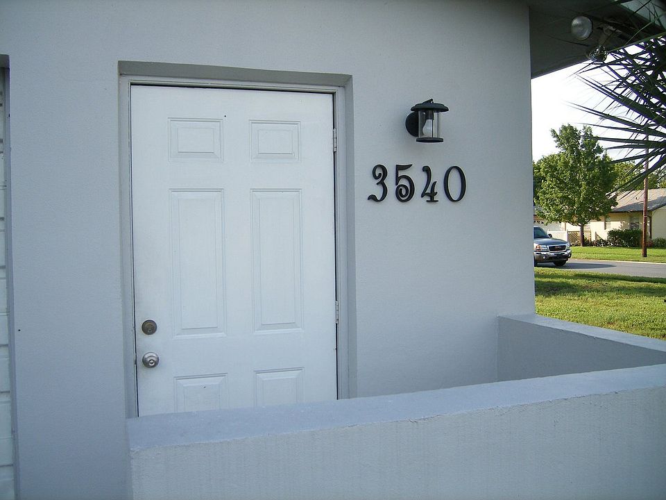 secondary entrance adjacent to the garage