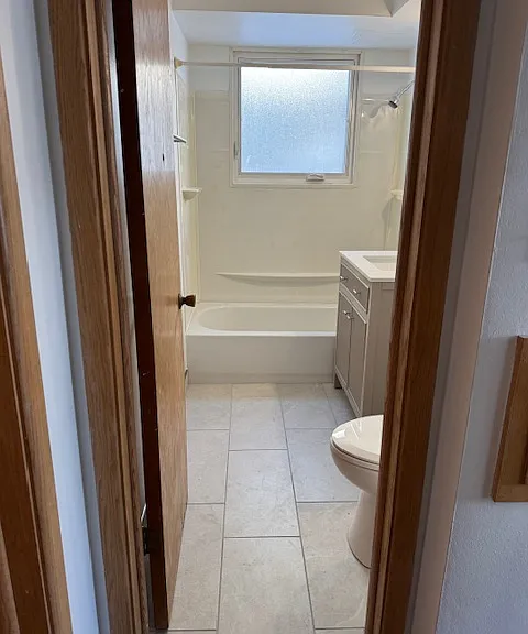 Bathroom 9'x5.' All new vanity, tile, toilet, vanity and light fixtures.
