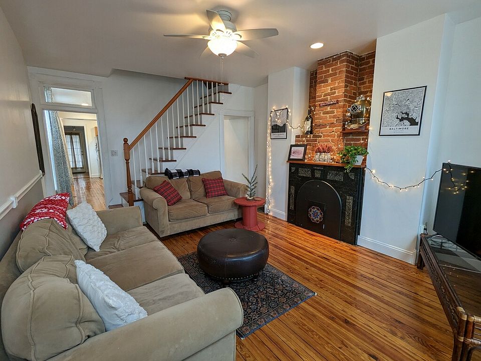 Living room with original fireplace and floors