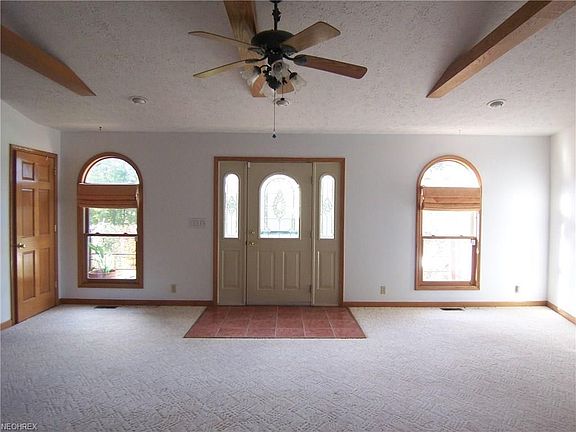 Enter from the front porch into a bright, large living room.