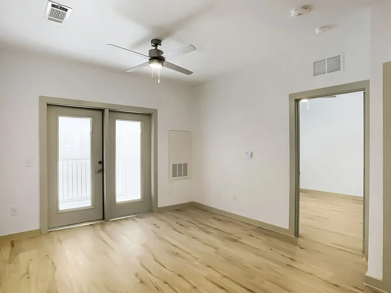 living room with doors to balcony or patio