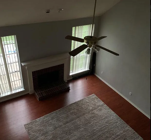 Amazing Family Room with an abundance of natural light inside via the wall of windows! Upgraded Modern Ceiling Fan with Light!
