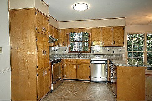 New Kitchen with Stainless Appliances and New Lighting