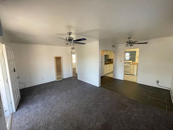 Living & dining areas with a view into the kitchen