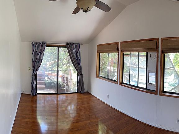 Bedroom with secured, 2-story cat patio, aka catio...replete with tunnels, mobiles, sunning deck, critter-proof locking doors and ground-level litter box cupboard.