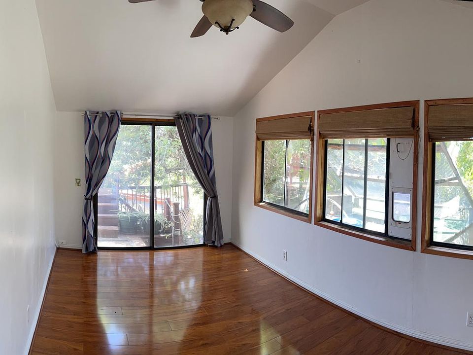 Bedroom with secured, 2-story cat patio, aka catio...replete with tunnels, mobiles, sunning deck, critter-proof locking doors and ground-level litter box cupboard.