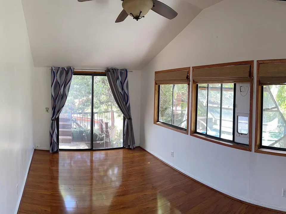 Bedroom with secured, 2-story cat patio, aka catio...replete with tunnels, mobiles, sunning deck, critter-proof locking doors and ground-level litter box cupboard.