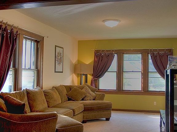 New carpet, paint and wonderful original woodwork in living room.