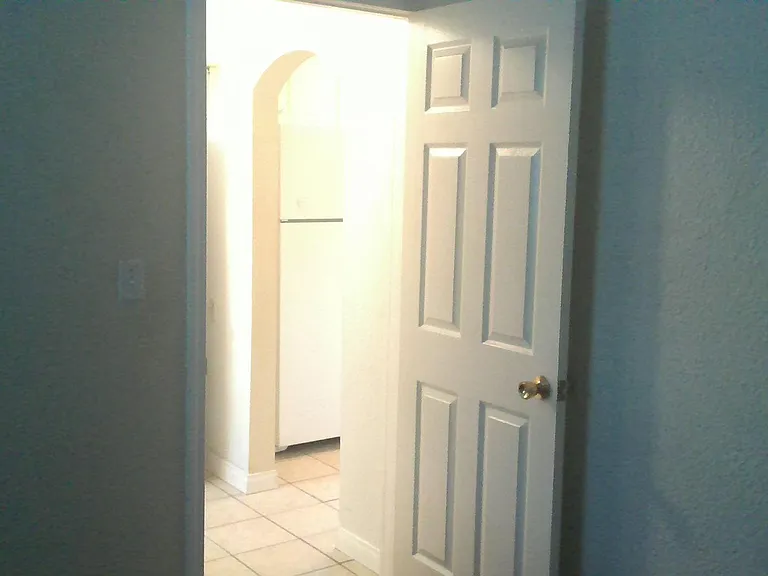 Back bedroom (11' 2" x 10' 3") towards kitchen
