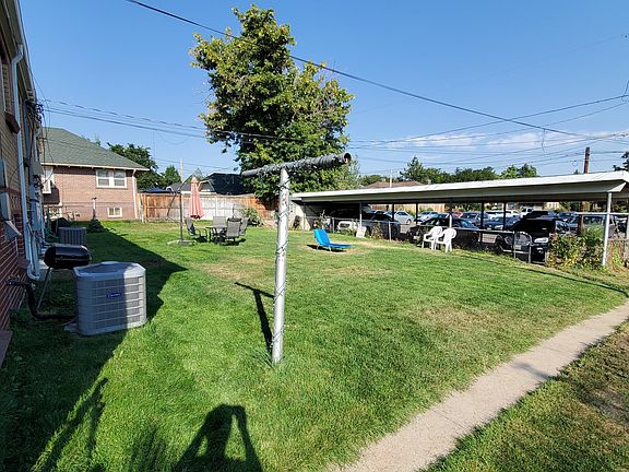 Backyard. Note covered parking in the back of the photo.