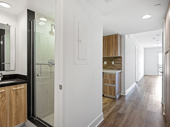 Entrance to Full-Size Guest Bathroom and Hallway Cabinet Storage