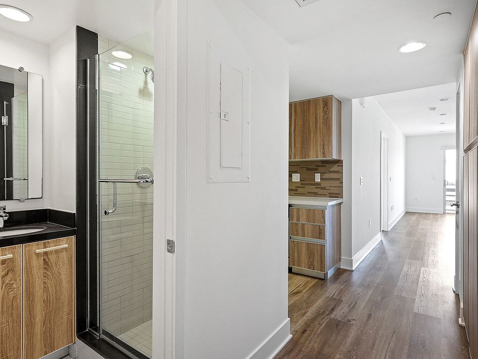 Entrance to Full-Size Guest Bathroom and Hallway Cabinet Storage