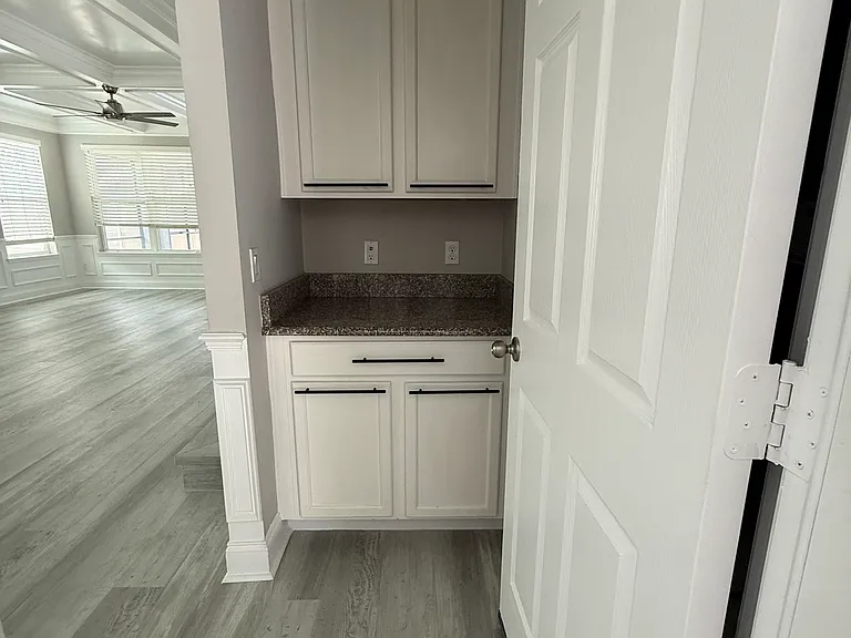 Tech area - Door is entry from garage. Laundry Room is behind the garage entry door