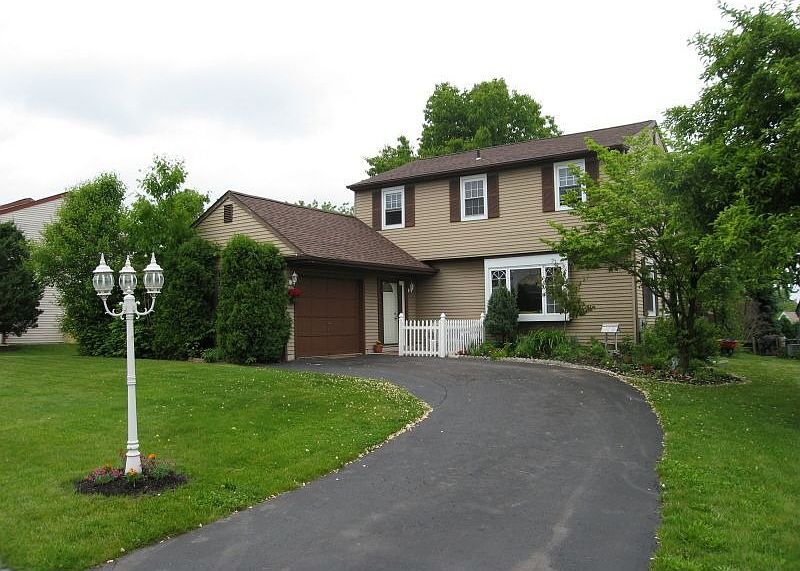 Colonial with new roof, newer windows, newer A/C and heater