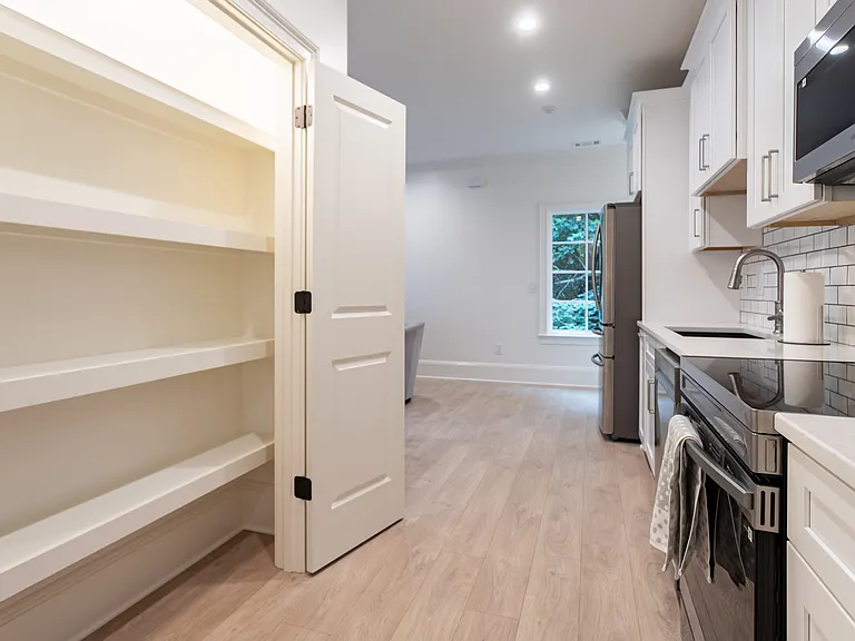 Full pantry with wood shelving