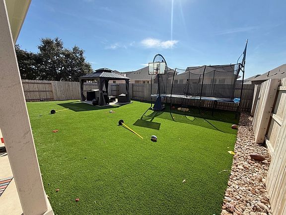 Turf backyard with permeant gazeboo