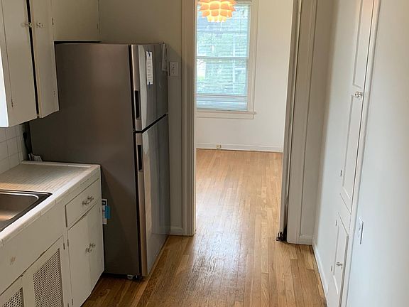 Kitchen featuring brand new, energy efficient, stainless steel refrigerator