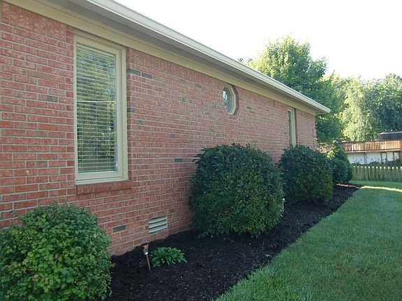View of home from the side.  Lawn is irrigated.