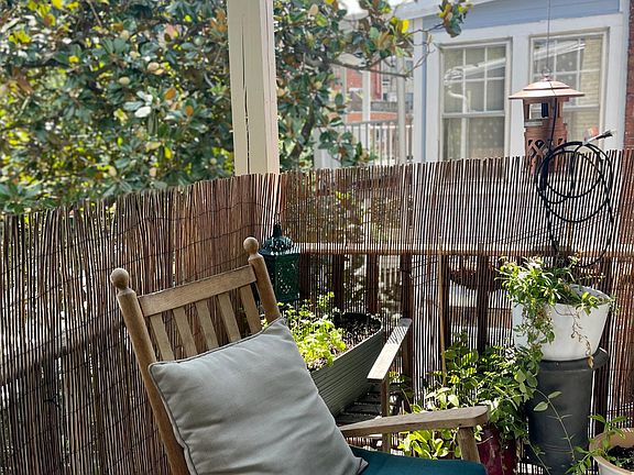 Sunny private balcony with pretty treetop view