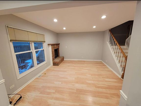 Spacious Living Room with brick fireplace