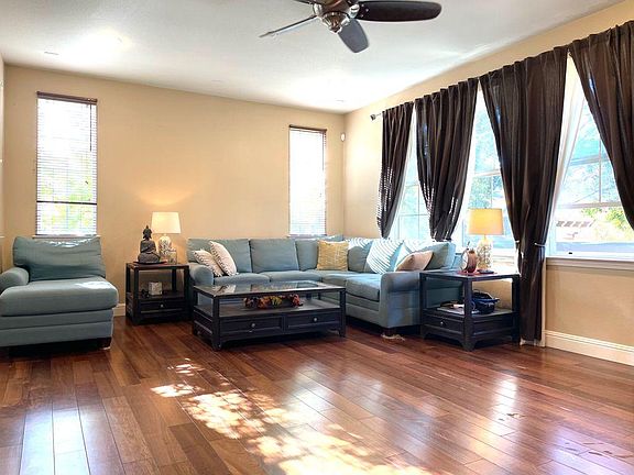 Living Room with large sized Windows, Entertainment Center, Gas Fire place, Hardwood floor