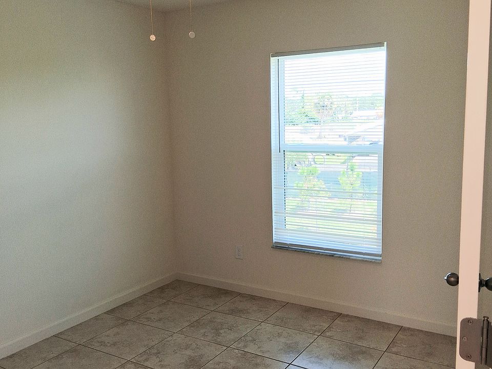 Bedroom with tile floors