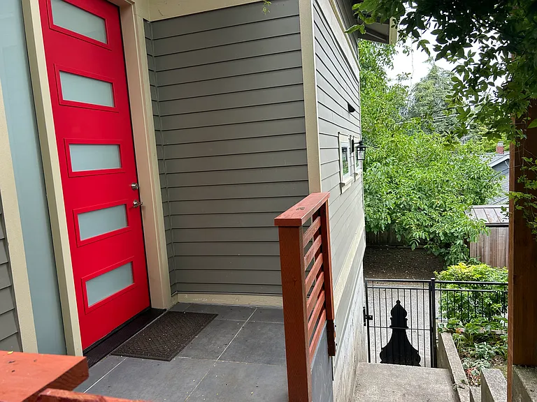 Private entrance up stairs from the alley. Gate has a lock.