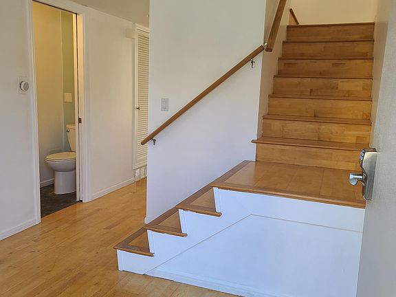 Front foyer with downstairs bathroom.