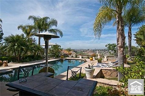 Rear yard is like your own private resort with view of hills, lake Mission Viejo and night lights.