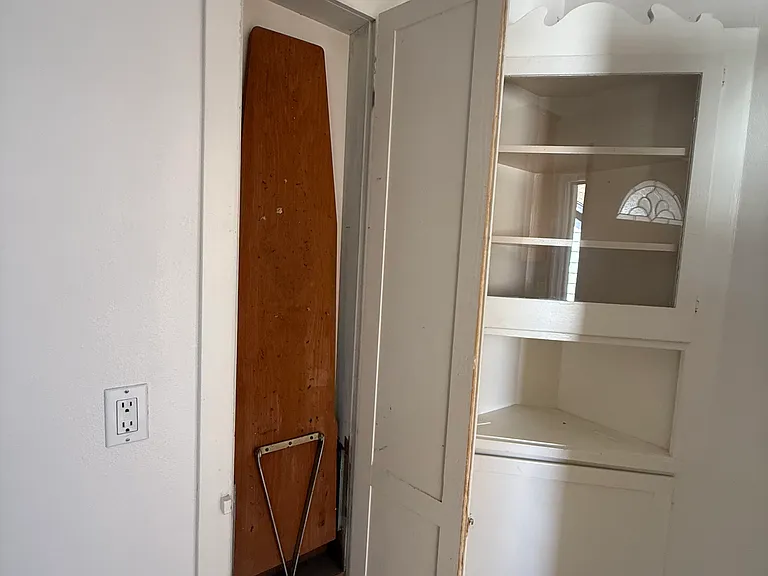 With a built in ironing board