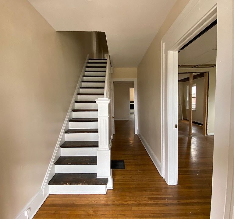 Foyer/Entry with coat closet. View of dining room then kitchen. Living room off to the right.