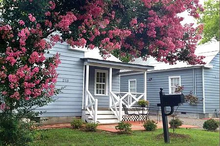 Crepe Myrtle Cottage welcomes you with classic Southern charm and mature landscaping.