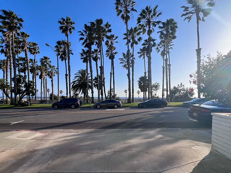 Secure gated parking garage with an ocean view.