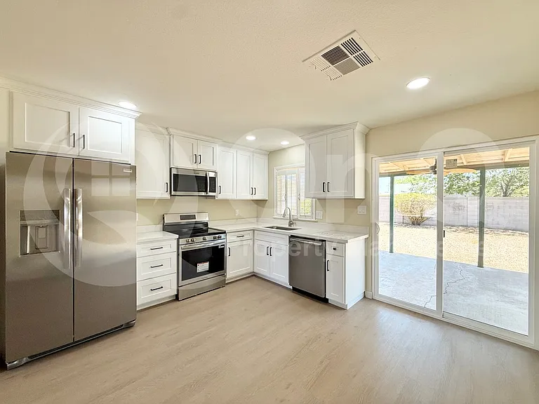 2465 E John Cabot Rd — Photo 3