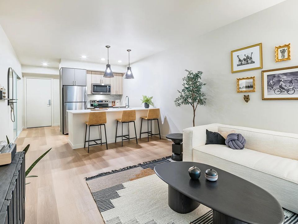 Gourmet kitchens with quartz countertops and custom cabinetry.