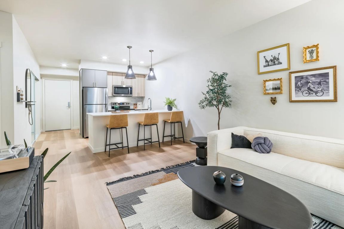 Gourmet kitchens with quartz countertops and custom cabinetry.