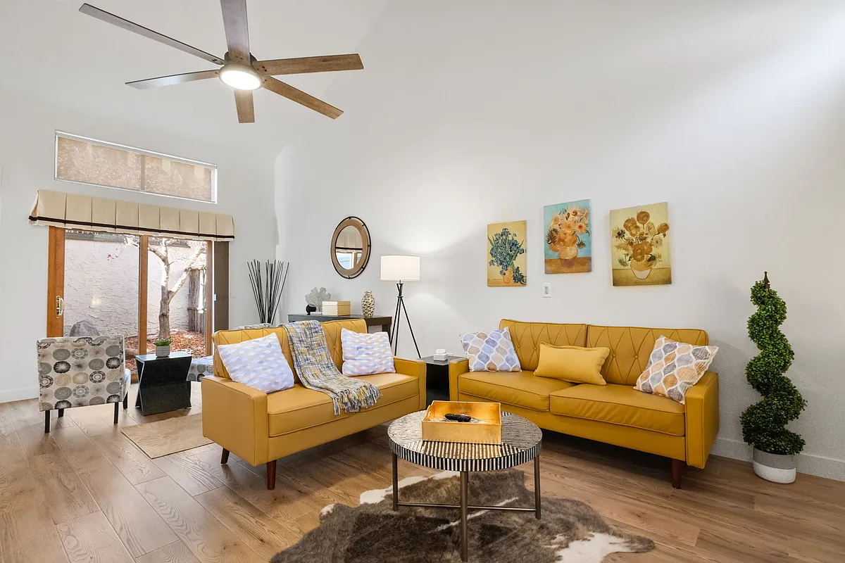 The spacious living room offers a comfortable and inviting atmosphere. - 1353 Coyote Rd