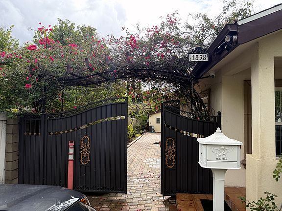 Picture-perfect curb appeal with a spacious front yard, mature fruit and ornamental trees, and an extra-wide driveway offering plenty of parking.