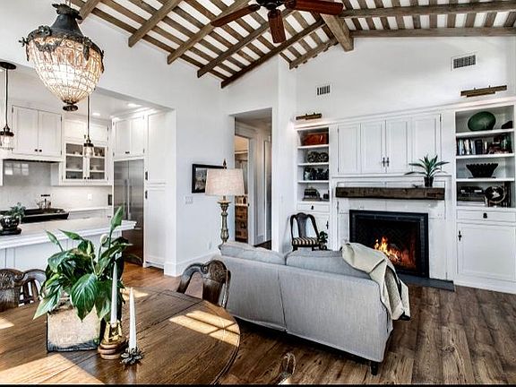 Built in book shelves along with the warmth of a fireplace give this new apartment the feeling of stability and timelessness.