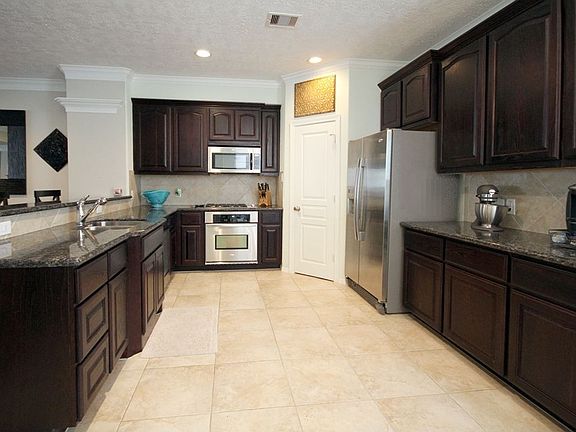 Great granite make up the spacious Kitchen countertops.