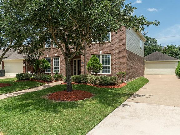 Mature shady trees flank the sidewalk, and an extended driveway leads to the detached garage! This homes exterior was recently updated with fresh paint, and it shows!