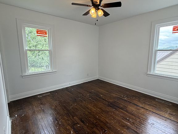 Downstairs back BR - BEFORE hardwood floors refinished