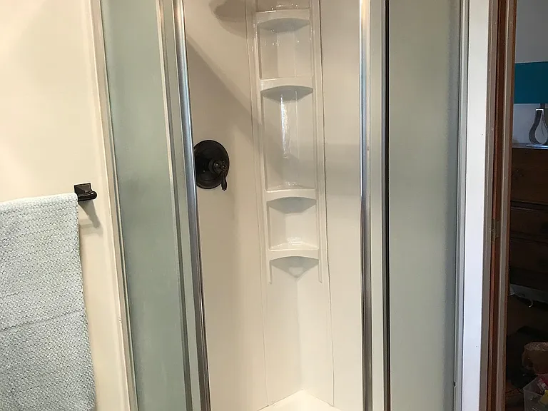 Brand new shower with rain head.