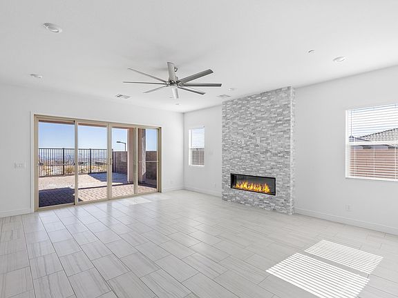 Living room with electric fireplace and ceiling fan