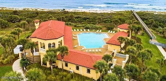 Clubhouse and pool area with beach access ramp