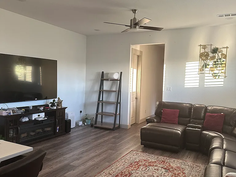 Spacious Hall with comfortable Media setup attached to the wall and space for large sofas