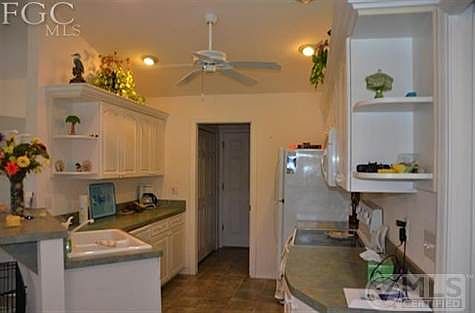 Kitchen and access to laundry room and garage.
