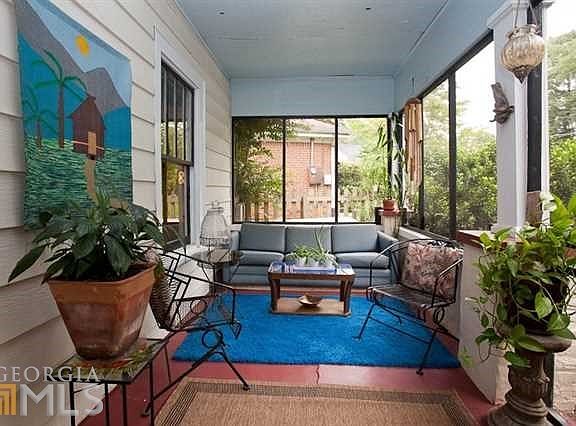 Wonderful screened porch spans the width of the house
