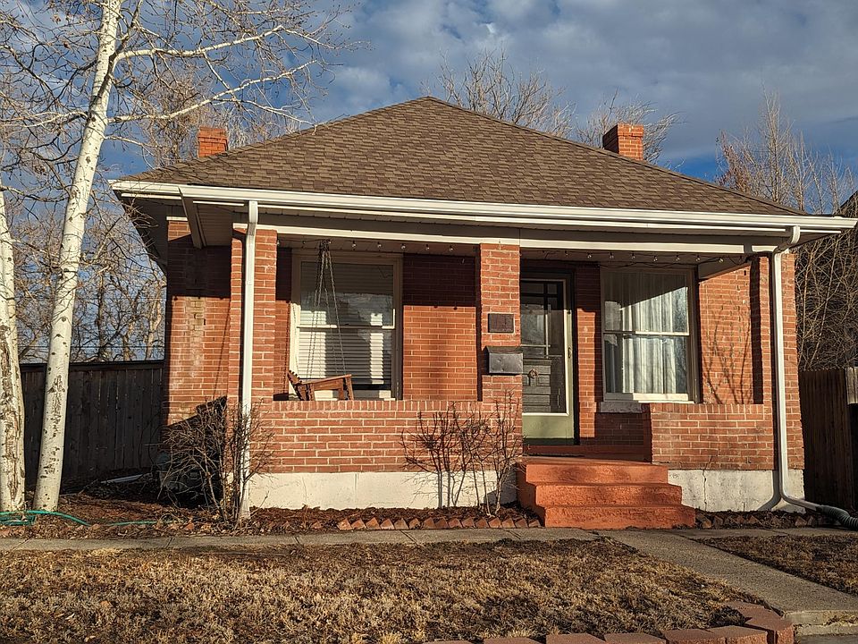 Exterior, covered front porch with swing