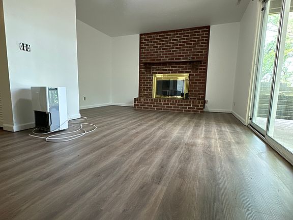 Ground floor living space with patio access - NEW flooring & paint